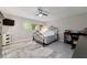 Relaxing bedroom featuring a metal bed frame and fluffy rug at 9357 Sw 82Nd Ter # B, Ocala, FL 34481