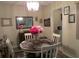 Bright dining room with round table, chairs, and a chandelier at 505 Fairways Ln # B, Ocala, FL 34472