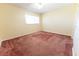 Spacious bedroom with carpeted floor and ceiling fan at 8530 Sw 90Th St # E, Ocala, FL 34481