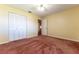 Bedroom with double door closet and carpet flooring at 8530 Sw 90Th St # E, Ocala, FL 34481