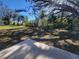 Large backyard with grass and a large oak tree at 7576 Sw 102Nd Loop, Ocala, FL 34476