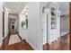 Long hallway with built-in white cabinets and wood floors at 22422 Lake Seneca Rd, Eustis, FL 32736