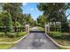 Private gated entrance to the property, enhancing security and exclusivity at 22422 Lake Seneca Rd, Eustis, FL 32736