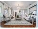 Bright living room with hardwood floors, neutral decor, and comfortable seating at 22422 Lake Seneca Rd, Eustis, FL 32736