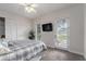 Bright bedroom with private access and ceiling fan at 22422 Lake Seneca Rd, Eustis, FL 32736