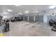 Spacious three-car garage with ample storage space for vehicles and equipment at 22422 Lake Seneca Rd, Eustis, FL 32736