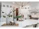 Modern kitchen with white cabinetry, large island, and high-end appliances at 22422 Lake Seneca Rd, Eustis, FL 32736