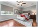 Guest bedroom with hardwood floors and red accents at 22422 Lake Seneca Rd, Eustis, FL 32736