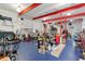 Spacious workshop with high ceilings, various tools, and a blue floor at 22422 Lake Seneca Rd, Eustis, FL 32736