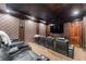 Home theater with tiered seating and large screen at 22422 Lake Seneca Rd, Eustis, FL 32736
