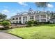 Stunning two-story home with a grand facade and manicured lawn at 22422 Lake Seneca Rd, Eustis, FL 32736