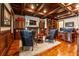 Spacious home office with built-in cabinetry and hardwood floors at 22422 Lake Seneca Rd, Eustis, FL 32736
