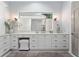 Modern bathroom vanity with white cabinets and quartz countertop at 22422 Lake Seneca Rd, Eustis, FL 32736