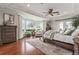 Spacious main bedroom with hardwood floors and bay windows at 22422 Lake Seneca Rd, Eustis, FL 32736