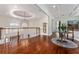Upstairs hallway with hardwood floors and a chandelier at 22422 Lake Seneca Rd, Eustis, FL 32736
