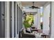 Inviting front porch with wicker furniture, perfect for relaxing outdoors at 22422 Lake Seneca Rd, Eustis, FL 32736