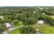 Aerial view of property showing house, barn, and expansive grounds at 22422 Lake Seneca Rd, Eustis, FL 32736