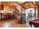 Rustic bar area with wooden stools and unique western decor at 22422 Lake Seneca Rd, Eustis, FL 32736