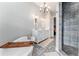 Elegant bathroom with soaking tub and walk-in shower at 22422 Lake Seneca Rd, Eustis, FL 32736