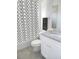 Clean bathroom features a shower/tub combo, white vanity, and granite countertop at 4473 Nw 48Th Ln, Ocala, FL 34474