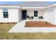 Modern home exterior featuring a front porch and landscaping at 4473 Nw 48Th Ln, Ocala, FL 34474