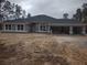 Front exterior of a single-story home with a two-car garage at 4378 Sw 113Th Pl, Ocala, FL 34476