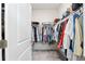 Large walk-in closet with ample hanging and shelving space at 5089 Stokes Way, Wildwood, FL 34785