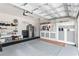 Organized garage with built-in shelving and storage at 5089 Stokes Way, Wildwood, FL 34785