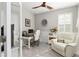 Bright and airy office with built-in shelving and comfortable seating at 5089 Stokes Way, Wildwood, FL 34785