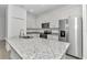 Modern kitchen with stainless steel appliances and granite countertops at 7930 Sw 127 Loop, Ocala, FL 34473