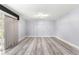 Bright living room with light gray walls and wood-look flooring at 551 Fairways Dr # A, Ocala, FL 34472