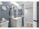 Updated bathroom with white vanity, gray walls, and modern fixtures at 551 Fairways Dr # A, Ocala, FL 34472