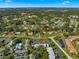 Aerial view showcasing a condo building's location within a residential neighborhood at 551 Fairways Dr # A, Ocala, FL 34472