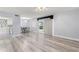 Spacious living area with light gray walls and wood-look flooring at 551 Fairways Dr # A, Ocala, FL 34472