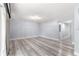 Spacious living area featuring light walls and wood-look floors at 551 Fairways Dr # A, Ocala, FL 34472