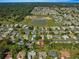 Aerial view showcasing home's setting near a lake at 8475 Se 137Th Loop, Summerfield, FL 34491