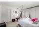Spacious bedroom with a double bed, ceiling fan, and ample closet space at 8475 Se 137Th Loop, Summerfield, FL 34491
