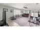 Spacious living room with comfortable seating, a large TV, and tile floors at 8475 Se 137Th Loop, Summerfield, FL 34491