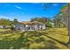 Private backyard with patio, mature trees, and plenty of green space at 8475 Se 137Th Loop, Summerfield, FL 34491