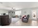 Bright living room with large windows and comfortable seating at 8475 Se 137Th Loop, Summerfield, FL 34491
