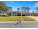 Aerial view of single-story home with a two-car garage and well maintained lawn at 8475 Se 137Th Loop, Summerfield, FL 34491
