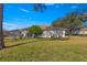 Spacious backyard with patio and lush landscaping offering a private retreat at 8475 Se 137Th Loop, Summerfield, FL 34491