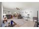 Spacious living room with comfortable seating and views into the dining area at 8475 Se 137Th Loop, Summerfield, FL 34491