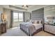 Main bedroom with a large bed, window, and en-suite bathroom at 4737 Nw 39Th Street Rd, Ocala, FL 34482