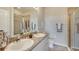 Bathroom with granite countertops, double sinks, and shower at 4743 Nw 39Th Street Rd, Ocala, FL 34482