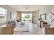Spacious living room with a cozy seating area and large window at 4743 Nw 39Th Street Rd, Ocala, FL 34482