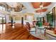 Grand entry with high ceilings, hardwood floors, and seating area at 17800 Se 237Th Ct, Umatilla, FL 32784