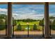 Stunning view of the expansive estate grounds from covered porch at 17800 Se 237Th Ct, Umatilla, FL 32784