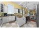 Modern kitchen with granite island and white cabinetry at 17800 Se 237Th Ct, Umatilla, FL 32784