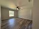 Bright bedroom featuring ceiling fan and wood-look flooring at 5558 Sw 204Th Ave, Dunnellon, FL 34431